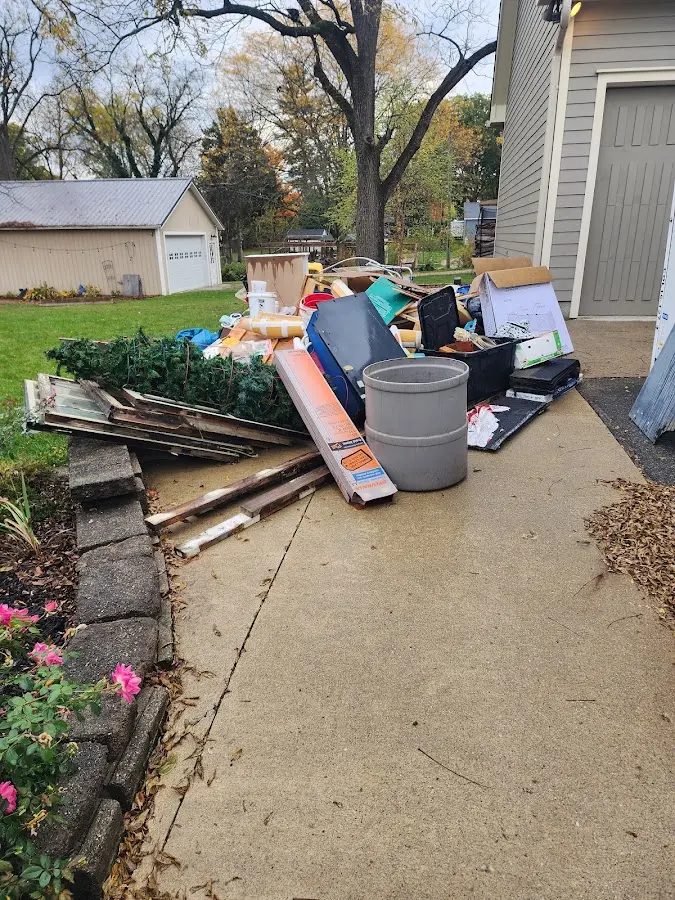 Dumpster being loaded with debris for Residential Dumpster Rental in Dry Run